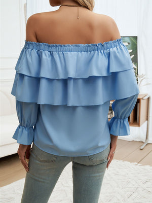 Cerulean tiered ruffle off-shoulder blouse with elastic neckline and bell sleeves.