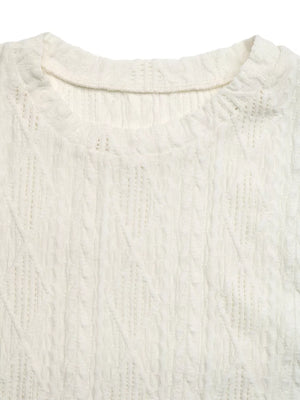 Diamond knit maternity t-shirt in cream with crew neckline and cap sleeves.