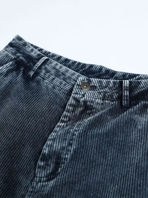 Blue corduroy cargo pants with textured fabric and button closure.
