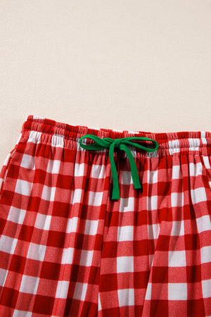 Festive red and white gingham pajama shorts with green drawstring detail.
