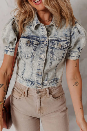 Cropped denim bolero jacket with puff sleeves and distressed details in medium wash.