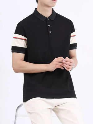 Black combed cotton polo with striped sleeve accents