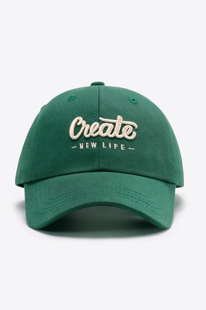 Green baseball cap with embroidered "Create - New Life" text