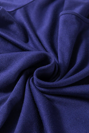Navy loungewear set fabric detail showing soft texture and draped folds.