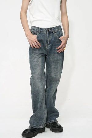 Baggy denim jeans in medium wash with subtle fading and a relaxed fit.