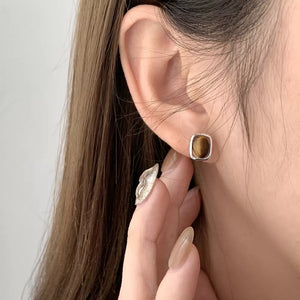 Silver square stud earrings with polished tiger eye stone