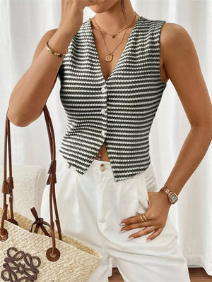 Chic striped knit V-neck tank top with button front, styled with white pants.