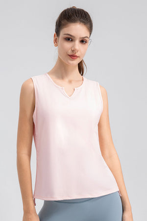 Blush pink active tank top with notched neckline and sleeveless design.
