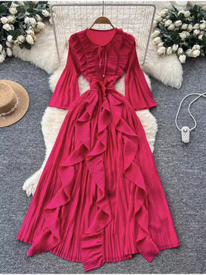 Rose Red brocade A-line midi dress with cascading ruffles and bell sleeves.