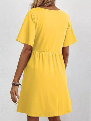 Yellow cotton v-neck mini dress with short sleeves and elastic waist