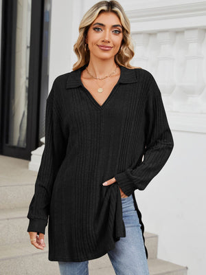 Black ribbed knit collared tunic top with slit hem and long sleeves.