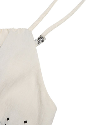 Beige romper with spaghetti straps and a subtle black geometric pattern detail.