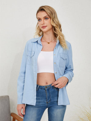 Light wash denim utility shirt with button front and chest pockets, styled with a white crop top and jeans.