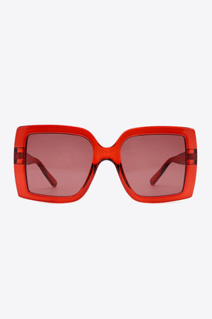 Crimson acetate rectangular sunglasses with pink lenses and bold frames.