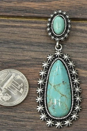 Celestial turquoise dangle earrings with ornate silver-tone alloy settings.