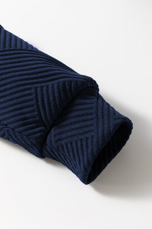 Navy textured polo set sleeve with geometric pattern detail