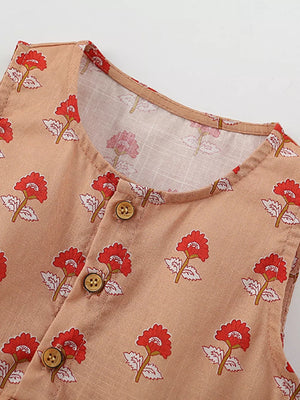 Toddler floral dress with button front and red flower pattern on tan cotton.
