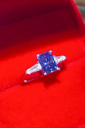 Blue moissanite ring in sterling silver with baguette side stones