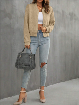 Camel diamond quilted bomber jacket with zipper closure and ribbed cuffs.