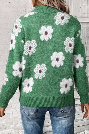 Green acrylic mock neck sweater with white floral intarsia pattern and ribbed cuffs and hem.