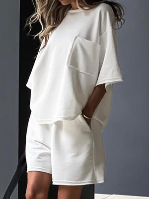 White raw-edge pocket tee and Bermuda shorts set for women, casual and comfortable.