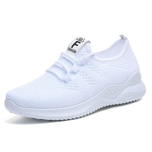White breathable knit runner sneakers with logo detail on tongue.
