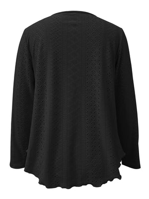 Black eyelet blouse with scalloped hem and long sleeves.