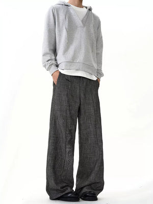 Men's grey textured wide leg sweatpants with a relaxed fit and ankle pooling detail.