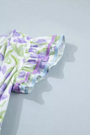 Lavender tulip print midi dress with ruffled sleeves and decorative trim.