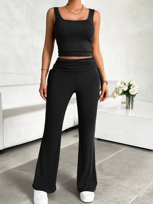 Black ribbed tank top and ruched waist flare pants set with drawstring details.