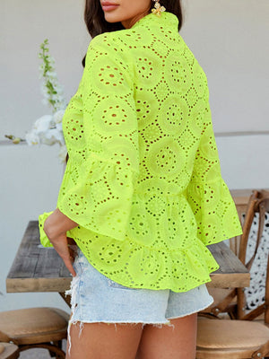 Neon yellow eyelet embroidered peplum blouse with ruffles and bell sleeves.