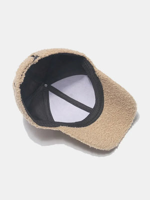 Khaki textured sherpa baseball cap with adjustable strap detail
