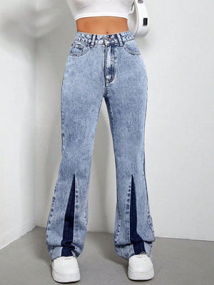 Light acid wash bootcut jeans with split hems and dark blue insets.