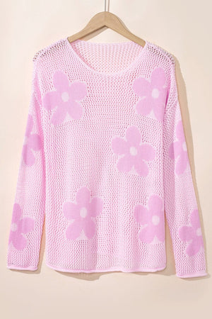Openwork floral intarsia sweater in blush pink acrylic with a v-neck and long sleeves.