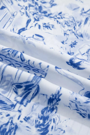 Safari-inspired V-neck shirt in white with blue toile print, polyester fabric.