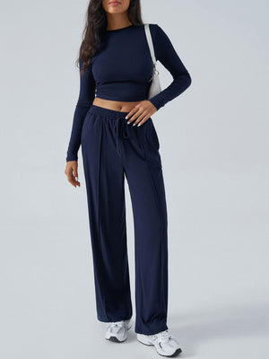 Dark blue ribbed knit crop top and wide leg pants set with drawstring waist.