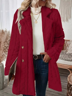 Red faux shearling double-breasted overcoat with textured pattern and gold buttons.