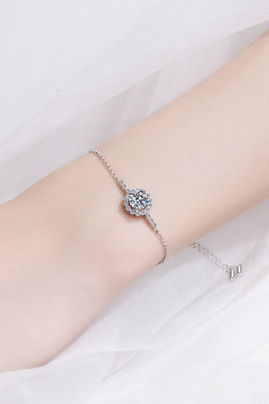 Silver adjustable bracelet with a central round diamond and halo detail