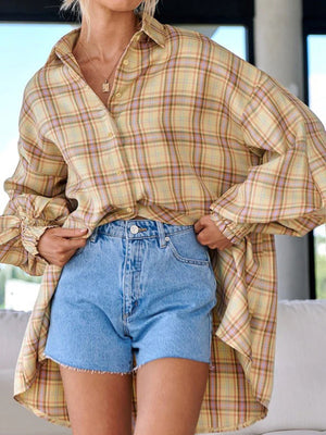 Pastel yellow plaid shirting with ribbed cuffs and buttoned front, styled with denim shorts.