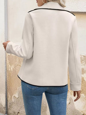 Beige double-breasted bolero jacket with black contrast trim and button details.