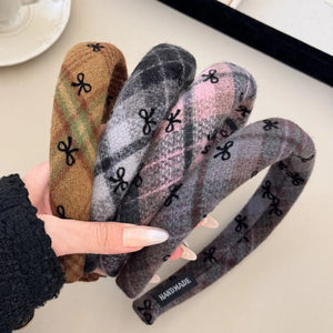Embroidered plaid padded headbands in blush pink, camel, and dark gray with bow detail.