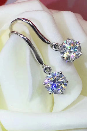 Silver drop earrings with cubic zirconia solitaire gems.