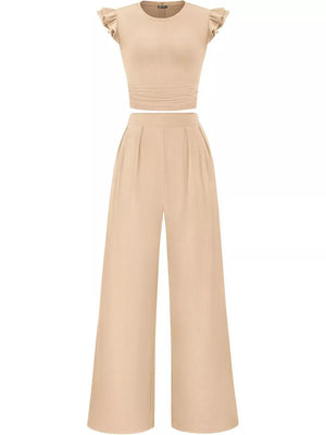 Apricot ruffled cap sleeve maternity top with ruched waist and wide leg pants.