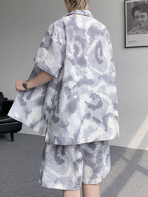 Men's casual camouflage shirt and shorts set in dark gray with textured fabric.