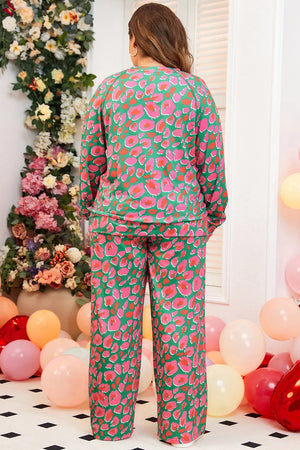 Botanical leopard print loungewear set in green with pink and coral spots, long sleeves, and wide-leg pants.