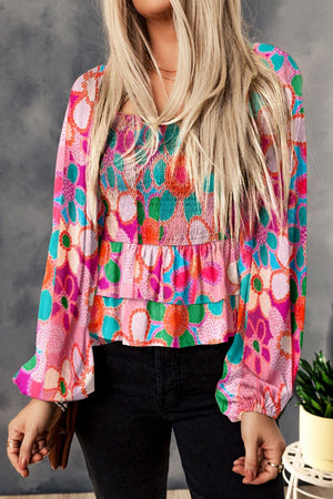 Multicolor floral smocked square neck blouse with tiered ruffle hem and balloon sleeves.