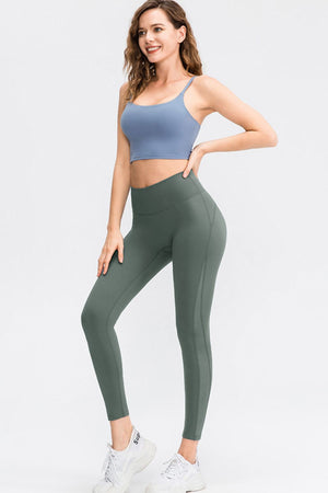 Matcha green performance leggings with subtle seam details and a high waist.