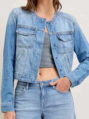 Light wash denim utility jacket with band collar and chest pockets.