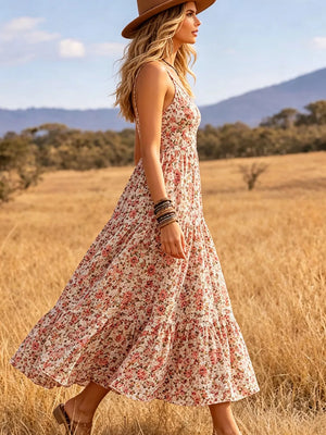 Floral print midi dress with V-neck and tiered skirt.
