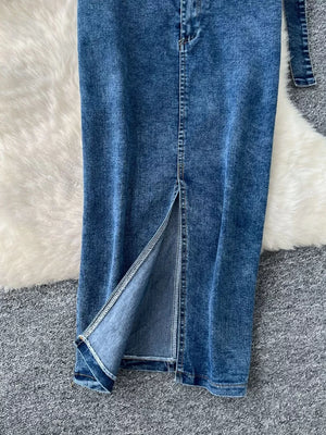 Blue denim maxi skirt with high slit and visible stitching detail